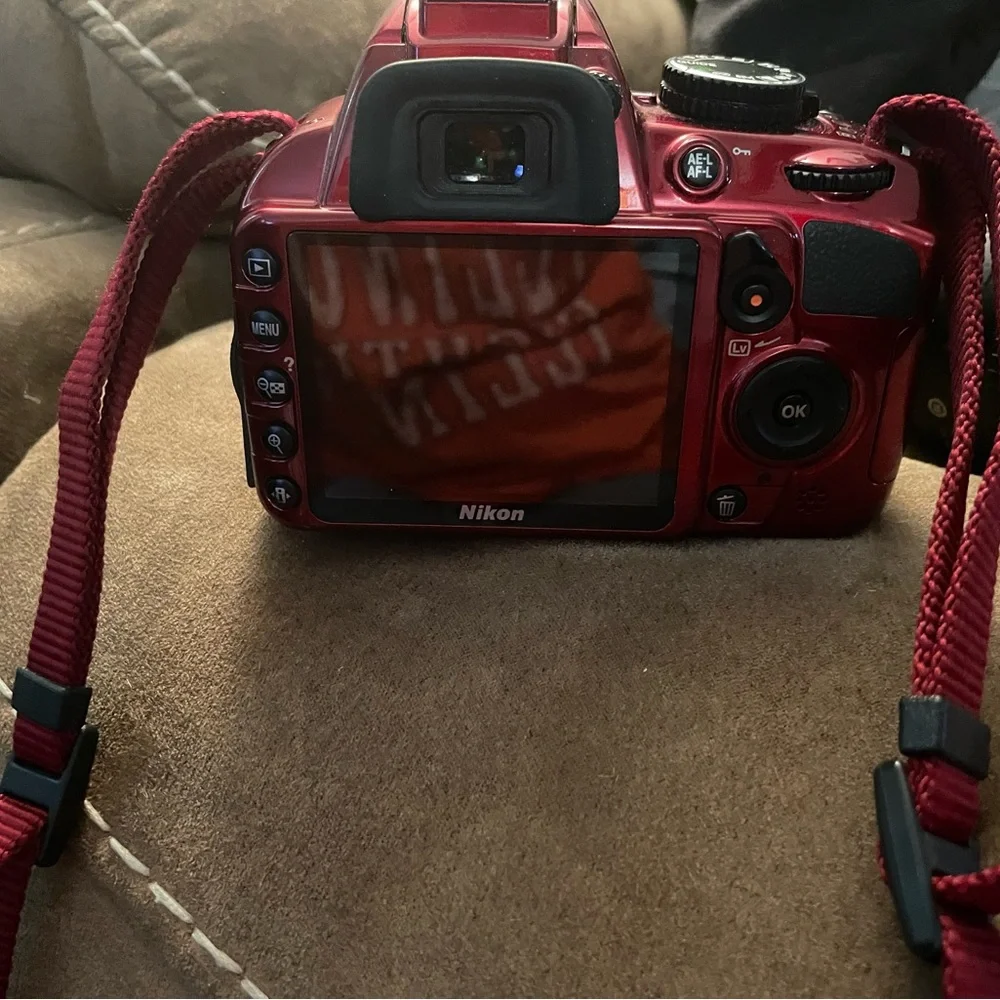 Cranberry Red Nikon digital camera with different size lense 2 battery w/charger